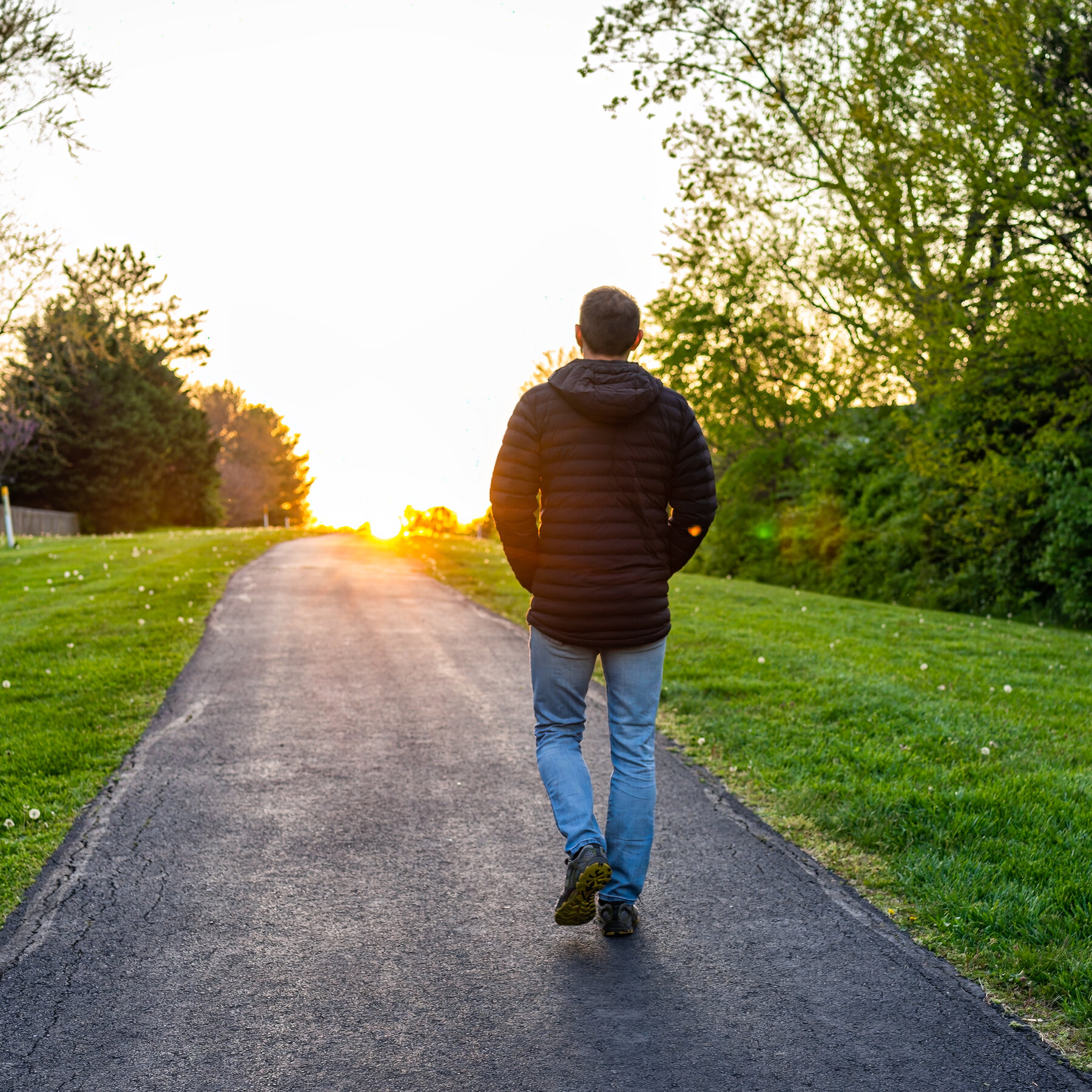 Person walking outdoors along scenic trail